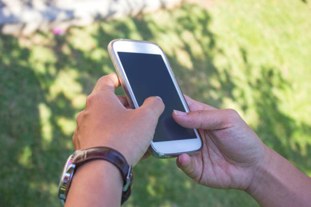 istock Business man using mobile phone in the park 865370158