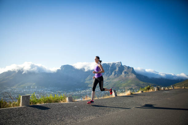 istock Female running fast on the road 865374644