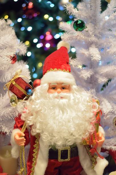 istock Christmas Holiday Background with Santa Claus & blurred LED lights 865375062