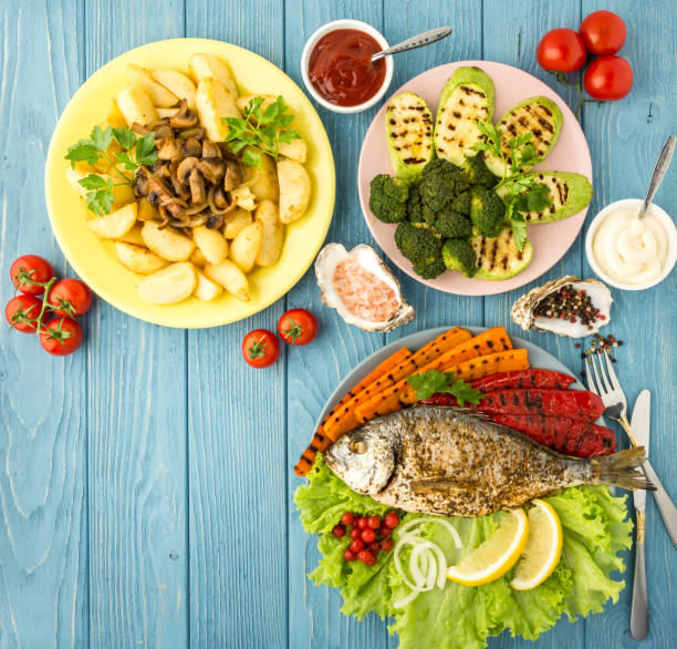Delicious and nutritious meal with fish and vegetables. Top view.