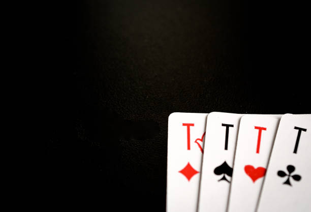 istock four aces on the black background, playing cards with copyspace 865375458