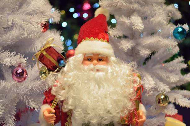 istock Christmas Holiday Background with Santa Claus & blurred LED lights in horizontal frame 865375488