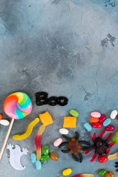 istock Colorful halloween candies on stone 865378970