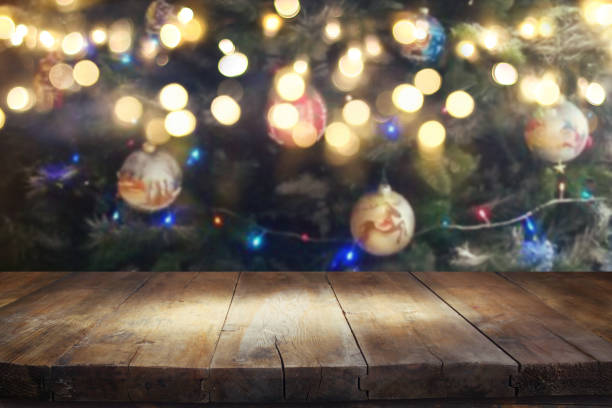 istock Empty table in front of christmas tree with decorations background. For product display montage 865384978