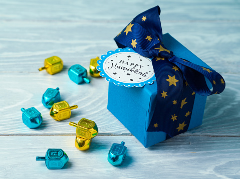 Hanukkah celebration with gift box and spinning top