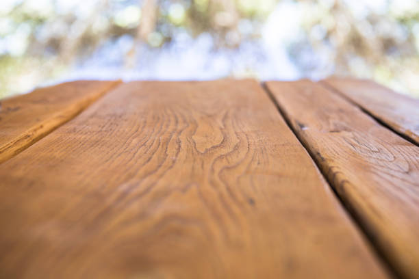 istock Wooden table at perspective. Focus on the center of a table 865385806