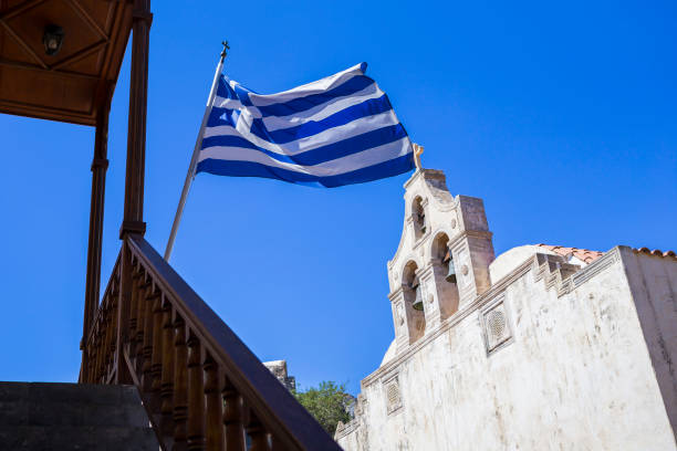 istock Greek flag in the Preveli Monastery at Crete, Greece 865386206
