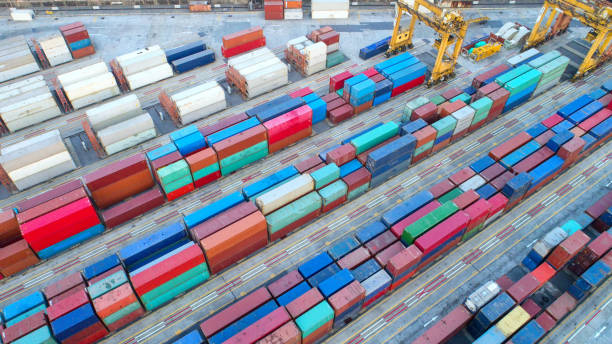 istock container,container ship in import export and business logistic,By crane,Trade Port , Shipping,cargo to harbor.Aerial view,Water transport,International,Shell Marine,transportation,logistic,trade,port 865388610