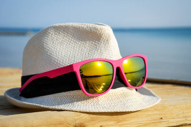 istock White hat with fashionable pink sunglasses 865389632