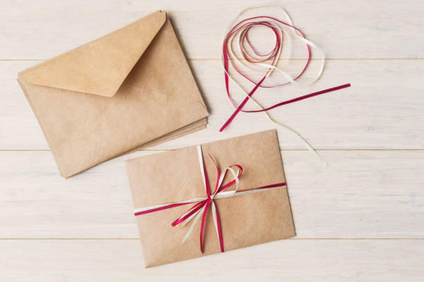istock Craft envelopes decoration with red and white ribbons 865392976