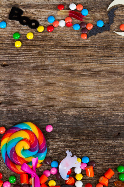 istock Colorful halloween candies on wood 865395678