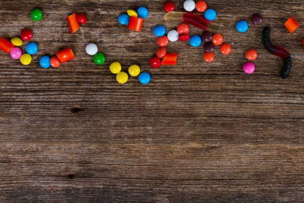 istock Colorful candies on wood 865395734