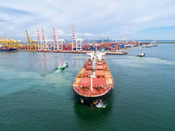 istock container,container ship in import export and business logistic,By crane,Trade Port , Shipping,cargo to harbor.Aerial view,Water transport,International,Shell Marine,transportation,logistic,trade,port 865396008