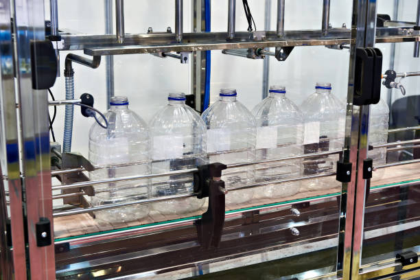 istock Conveyor with plastic bottles for food industry 865396266