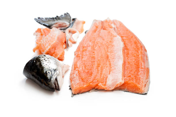 istock salmon  fillet with head and bones isolated on white background 865399418