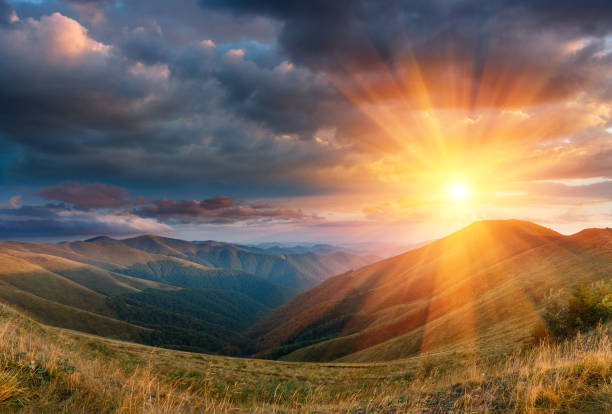 Panoramic landscape of fantastic sunset in the autumn mountains. stock photo