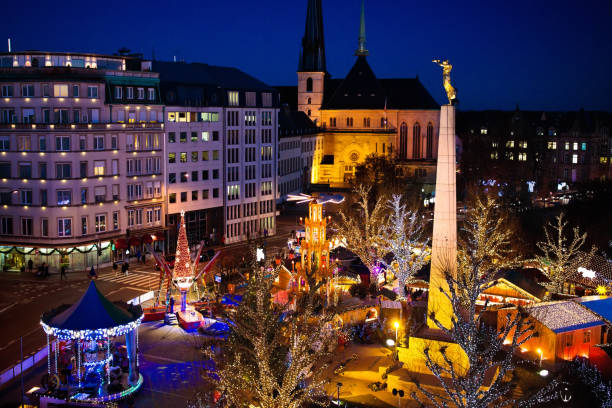 istock Christmas market. Winter fair with tree and lights. 865401082