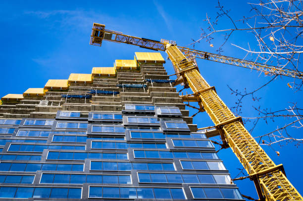 Yellow crane on a construction site stock photo