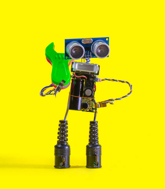 istock Repair serviceman robot on yellow background 865425472