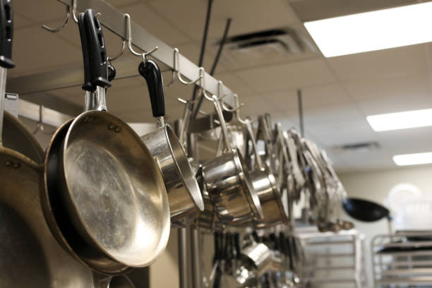 istock Empty restaurant kitchen stainless steel pots, pans, utensils. 865428790