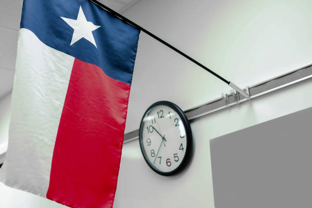 Texas high school classroom flag, clock. stock photo