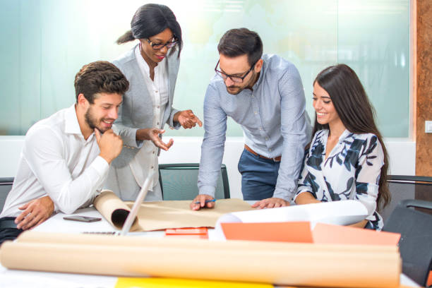 istock Team of entrepreneurs communicating while developing a new business strategy at office. 865431614