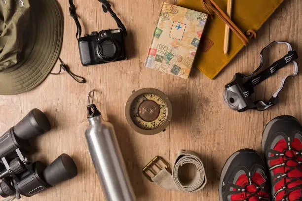 Photo of Overhead view of travel equipment for a backpacking trip.