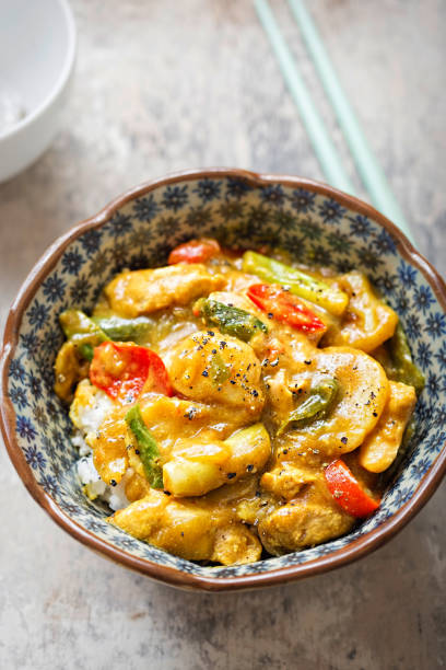 istock Katsu green chicken curry. Cooked jasmine rice with cooked marinated chicken in coconut, soy sauce, served with vegetables. 865432764
