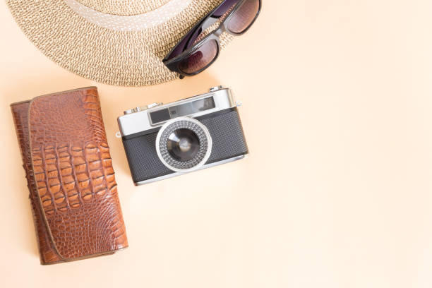 istock Film camera and wallet on yellow background,top view 865432876