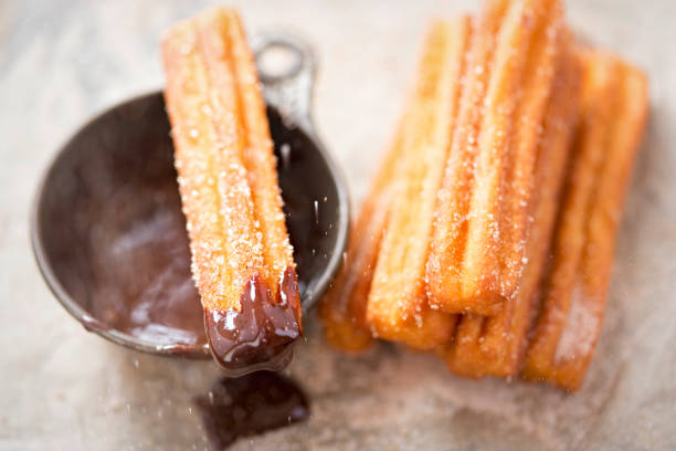 istock Churros with sugar and chocolate sauce 865432930