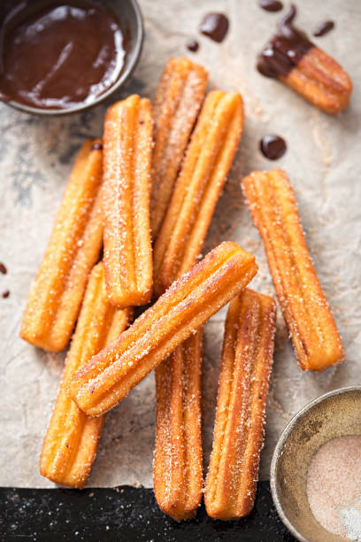 Churros with sugar and chocolate sauce