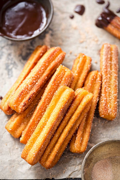istock Churros with sugar and chocolate sauce 865435024