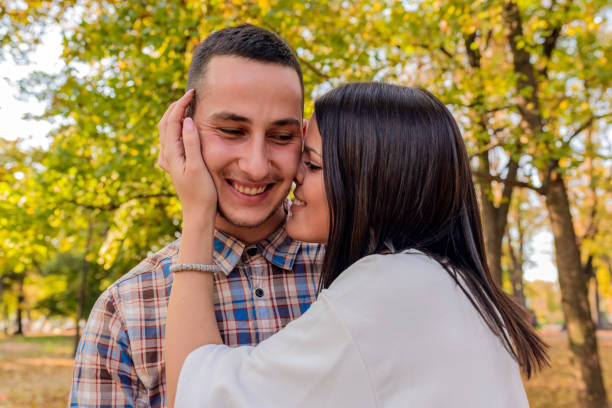 istock Nice couple having fun in autumn park 865435104