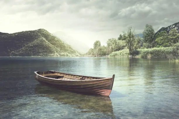 Photo of Wooden boat floating in a mystic river