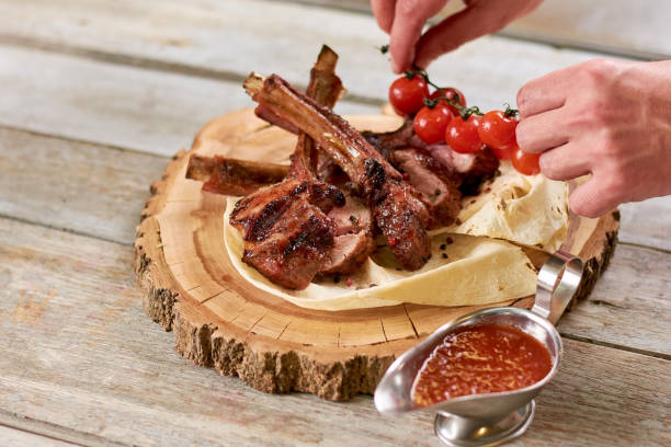 istock Chef served roasted calf ribs with cherry. 865435532