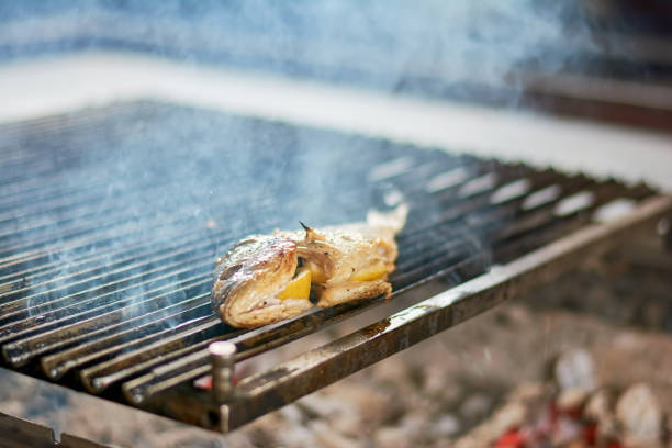istock Fish with lemon grilling on grill. 865439500