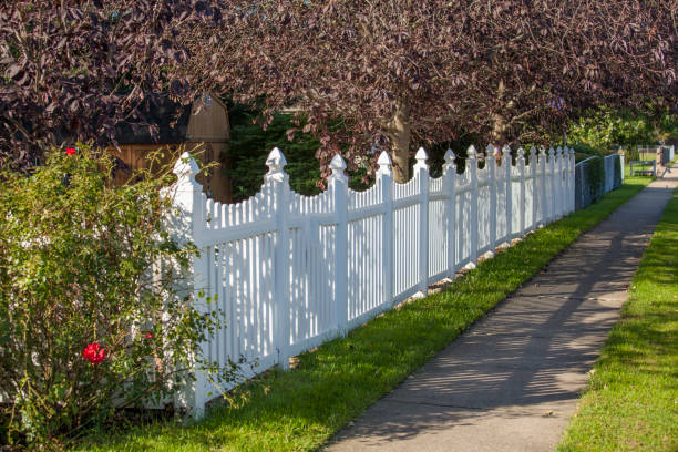 istock White vinyl picket fence 865439654