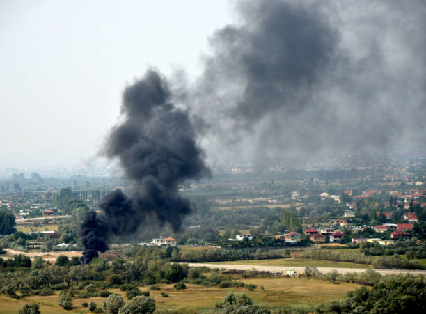 istock Forest fire close to human settlement 865439840