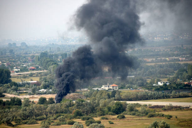 istock Forest fire close to human settlement 865439856