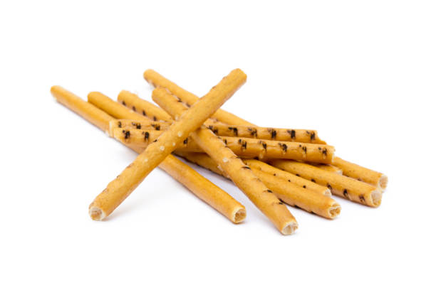 istock Salty cracker pretzel sticks isolated on white background 865439982