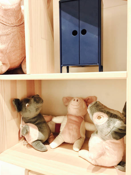 istock Three Little Pig Dolls Sitting in A Box 865440052