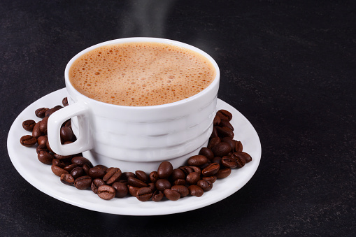 Traditional Indian, Madras filter coffee in a steel cup also known as tumbler and dabarah, south indian style, selective focus