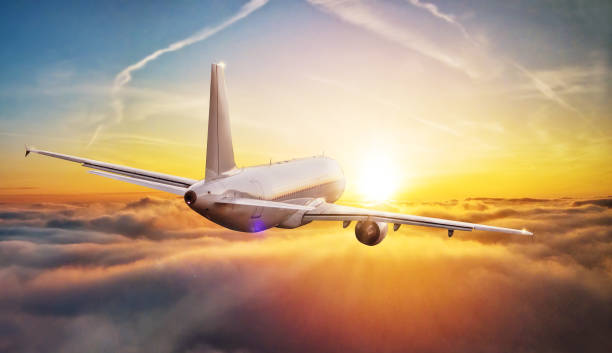 istock Commercial airplane flying above clouds 865448332