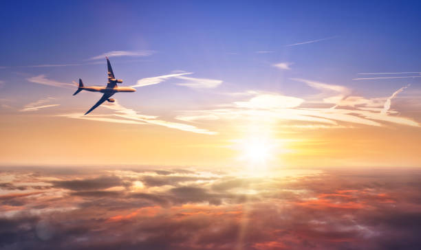istock Commercial airplane flying above clouds 865448482