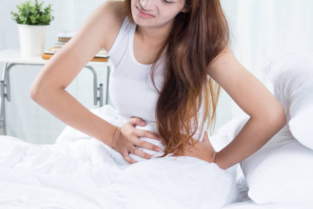 female stomachache Because Poisonous food female stomachache Because Poisonous food urinary tract infection stock pictures, royalty-free photos & images