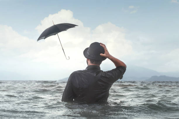istock strong wind make umbrella fly surreal business bad luck concept 865449664