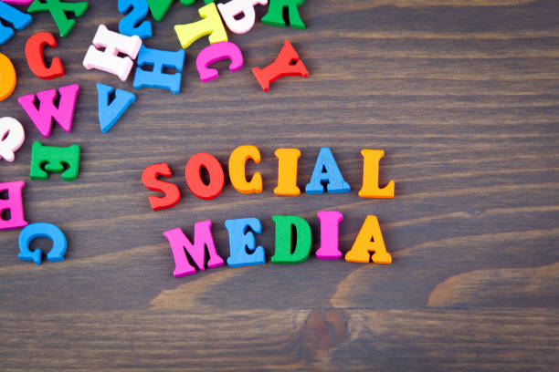 istock social media. various colored wooden letters on a dark plate 865452502