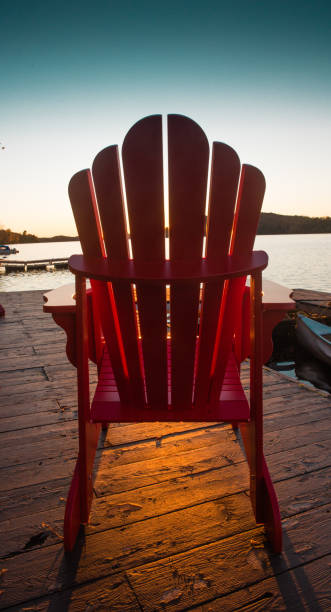 istock Chair on the dock at sunset 865459674