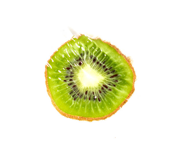 istock juicy kiwi fruit in water on a white background. macro 865460420