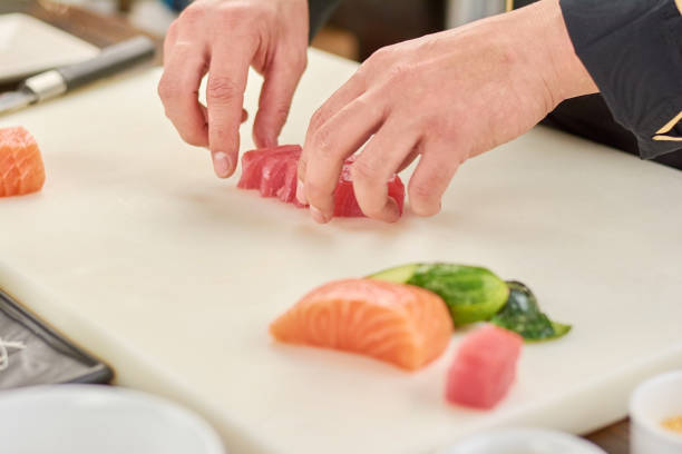 istock Chef sliced raw tuna fillet. 865463516